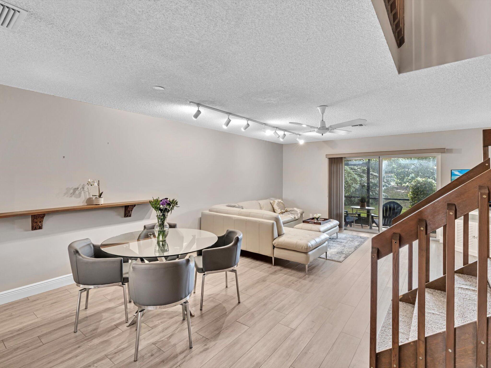 6318 Walk Circle Boca Raton, FL 33433 - Photo 8 of 43 a living room with furniture and a large window