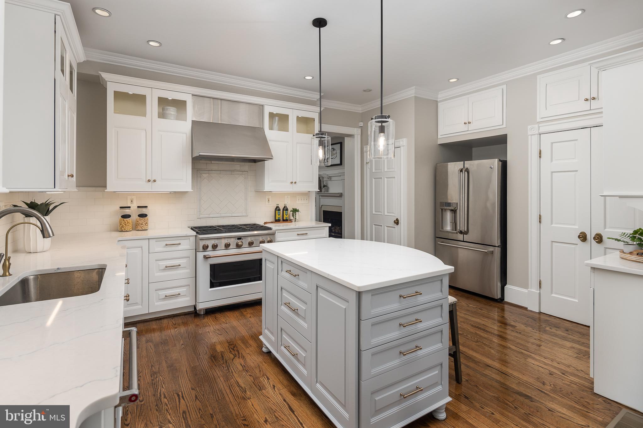 1730 Park Road Northwest Washington, DC 20010 - Photo 17 of 74 Renovated kitchen, pendant lights, white cabinets