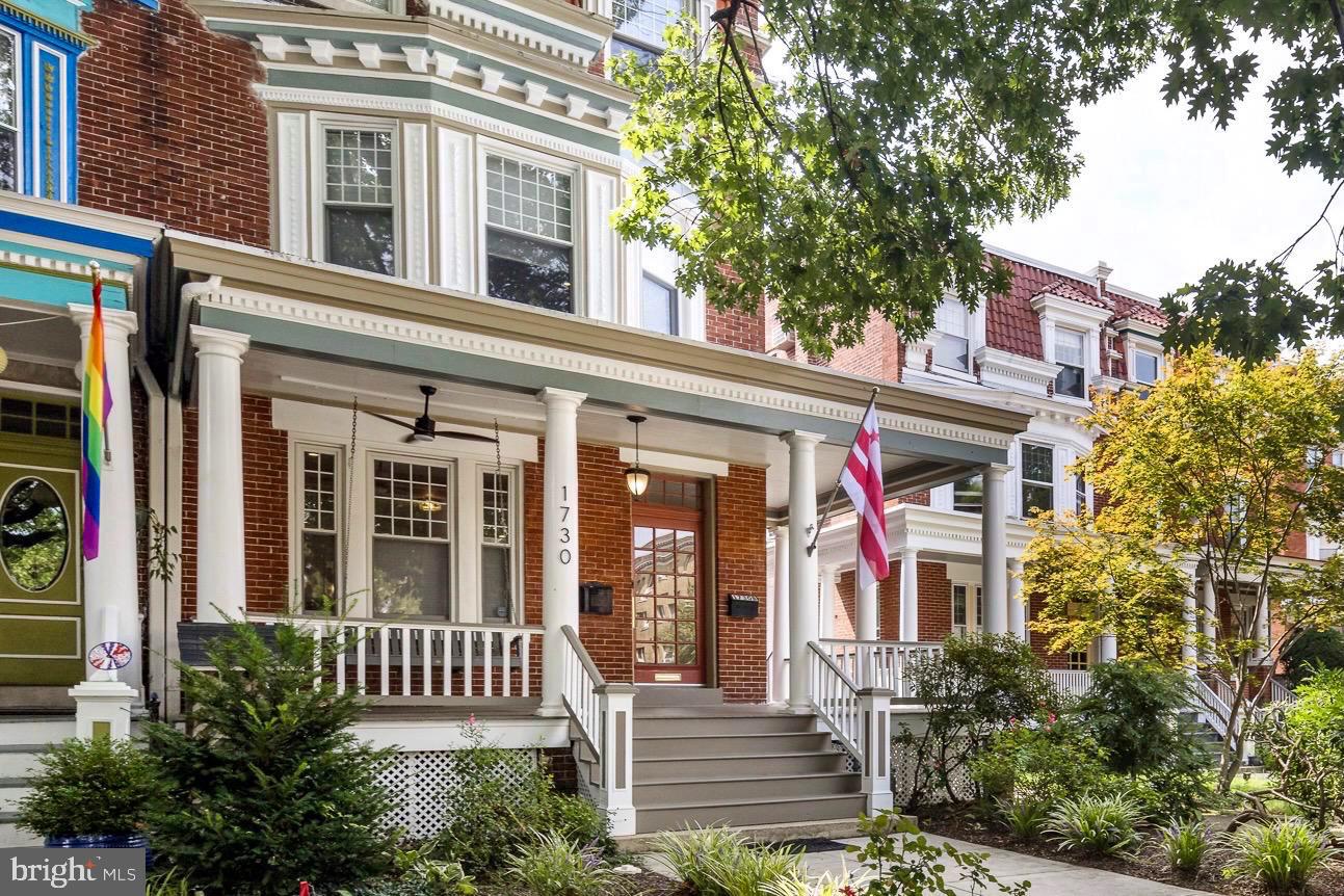 1730 Park Road Northwest Washington, DC 20010 - Photo 2 of 74 Large front porch, brick townhouse, DC flag
