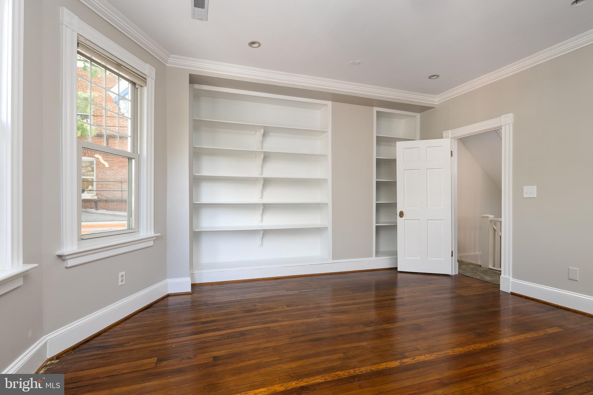 1730 Park Road Northwest Washington, DC 20010 - Photo 23 of 74 Built-in shelves, library, media room, bedroom