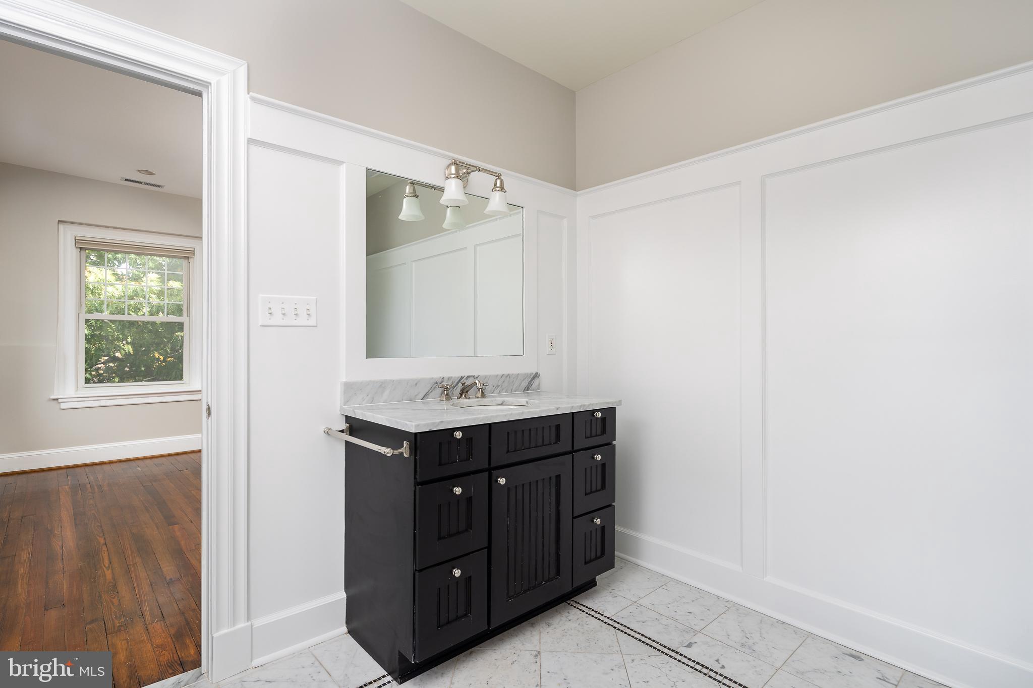 1730 Park Road Northwest Washington, DC 20010 - Photo 39 of 74 En suite bath, ensuite, carrara marble tile, sink
