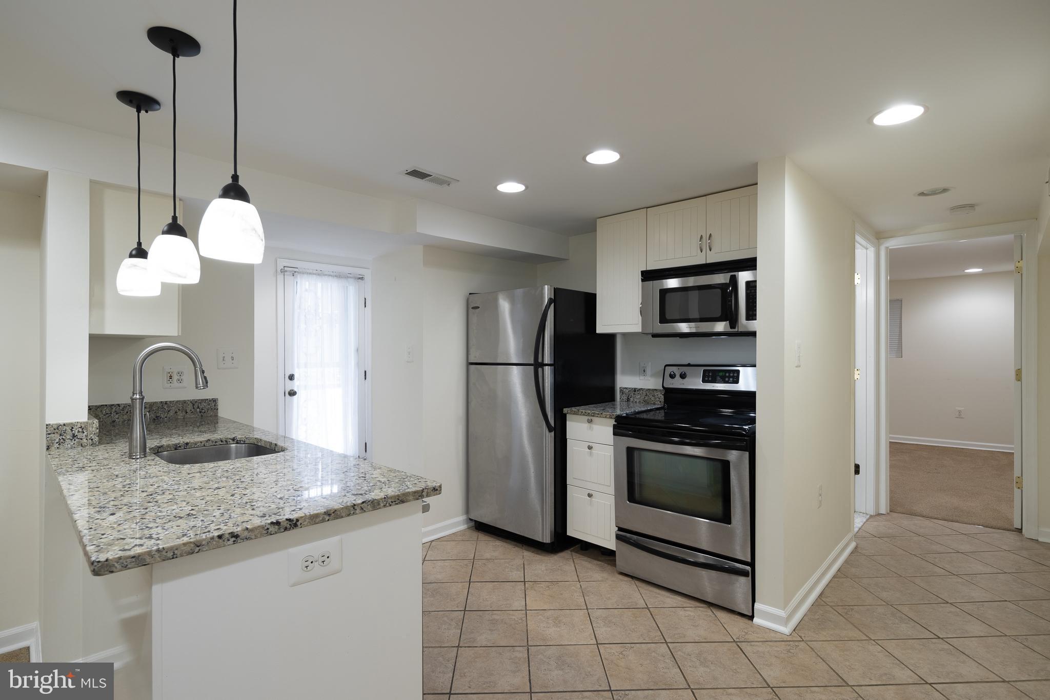 1730 Park Road Northwest Washington, DC 20010 - Photo 55 of 74 Kitchen, tile, stainless steel appliances, rental