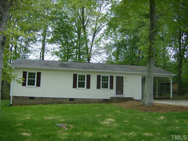 1502 Stone Drive Roxboro, NC 27573 - Photo 1 of 10 front view of a house with a yard