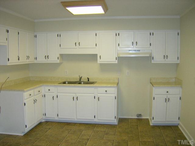 1502 Stone Drive Roxboro, NC 27573 - Photo 2 of 10 a view of white cabinets