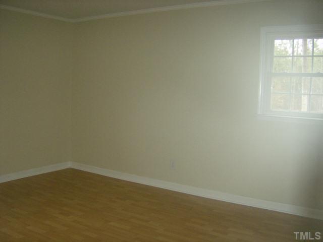 1502 Stone Drive Roxboro, NC 27573 - Photo 6 of 10 an empty room with a window