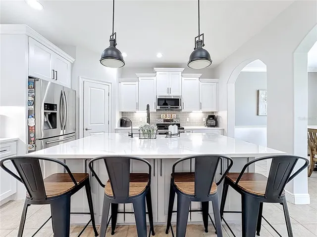 a bedroom with furniture and a chandelier
