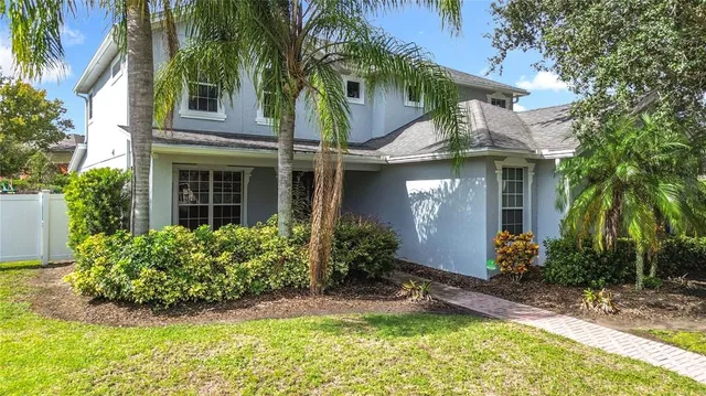 a view of a pathway both side of the house