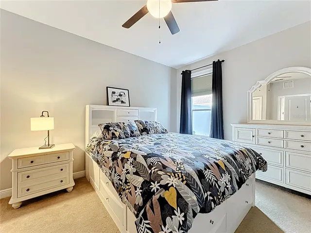 a bathroom with a granite countertop sink a shower and a mirror