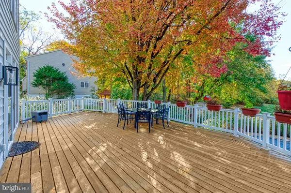 a view of a chair and tables in the balcony