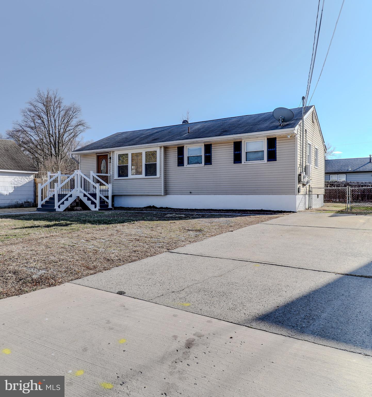 121 Nottingham Road Pennsville, NJ 08070 - Photo 1 of 14 a front view of a house with a yard