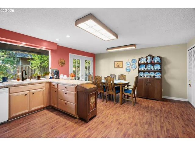 a open kitchen with sink cabinets and wooden floor
