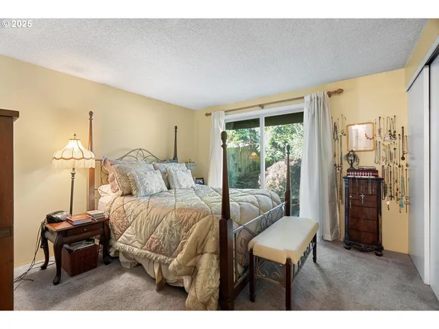 a bedroom with a bed and a view of bathroom