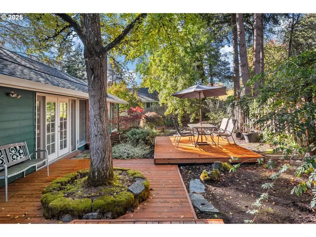 a view of a patio with chairs and a yard