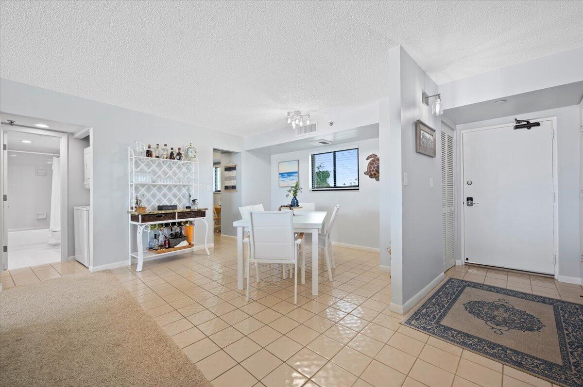 100 Ocean Trail Way, Unit 107 Jupiter, FL 33477 - Photo 8 of 34 Foyer and Dining Room