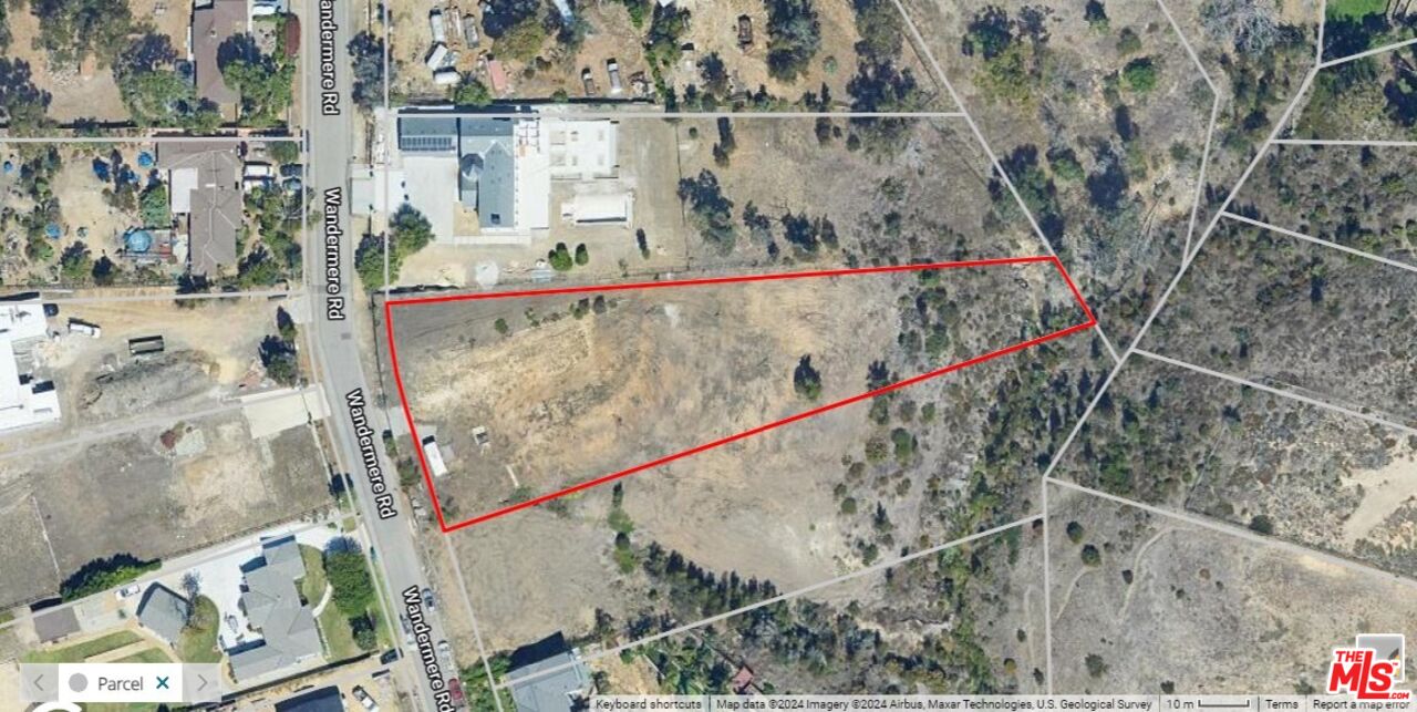 6660 Wandermere Road Malibu, CA 90265 - Photo 4 of 29 a view of swimming pool with a yard and sitting area