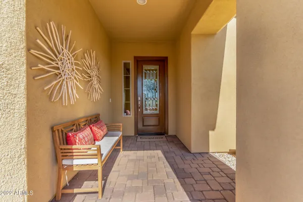 a hallway with a bench in it