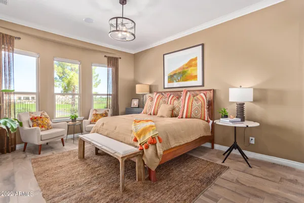 a bedroom with a bed lamps and window