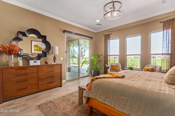 a bedroom with a bed and a dresser