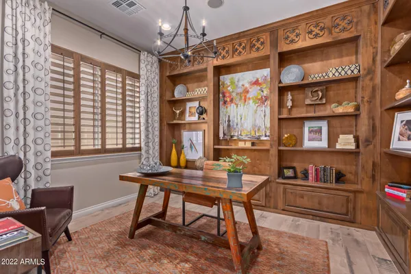 a workspace with furniture and a window