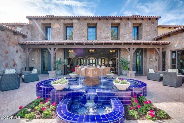 a view of a patio with a table chairs and a backyard