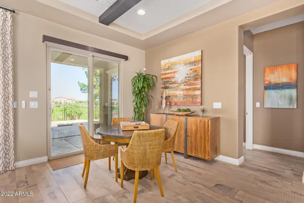 a dining room with furniture window wooden floor