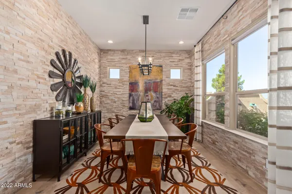 a view of a dining room with furniture window and outside view