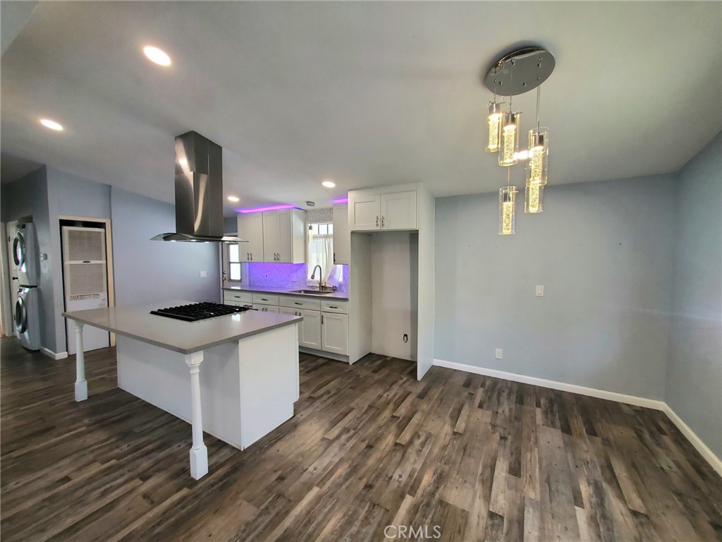 27361 Sierra Highway, Unit 19 Canyon Country, CA 91351 - Photo 12 of 26 a kitchen that has a lot of cabinets and stainless steel appliances