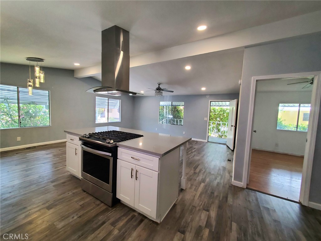 27361 Sierra Highway, Unit 19 Canyon Country, CA 91351 - Photo 14 of 26 an open kitchen with sink and stainless steel appliances