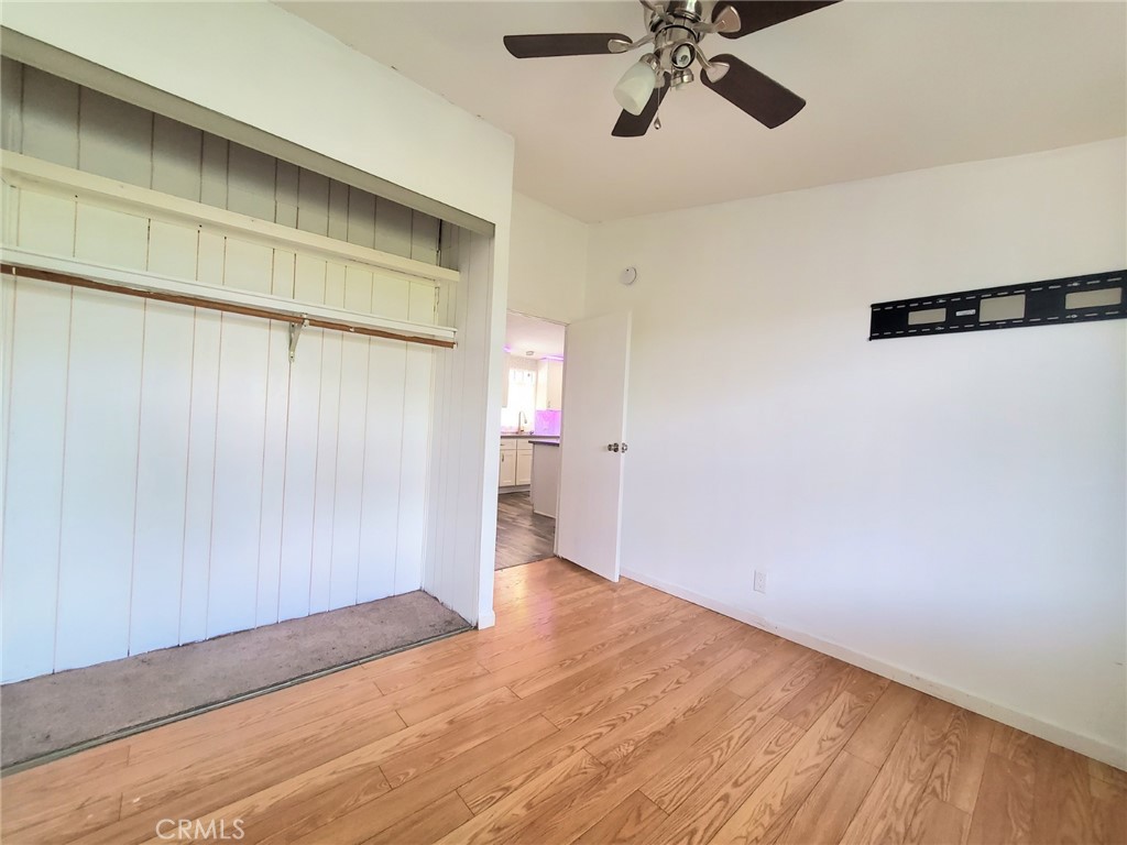 27361 Sierra Highway, Unit 19 Canyon Country, CA 91351 - Photo 16 of 26 a view of empty room with wooden floor