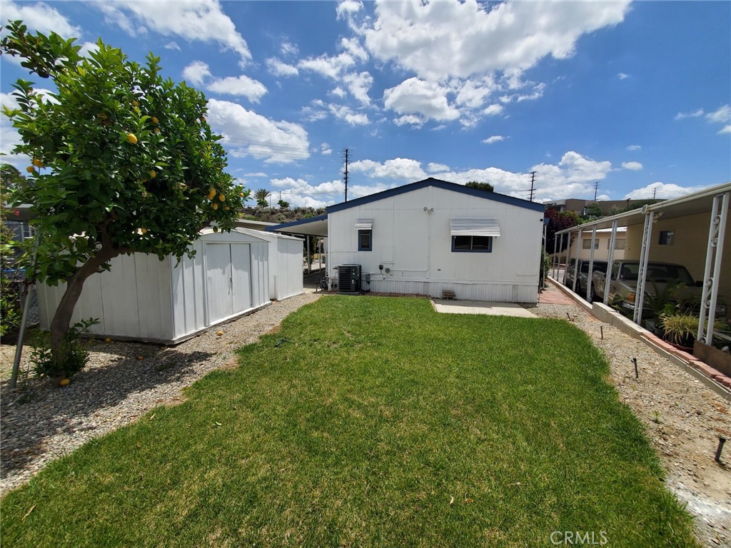 27361 Sierra Highway, Unit 19 Canyon Country, CA 91351 - Photo 6 of 26 a view of house with backyard and garden