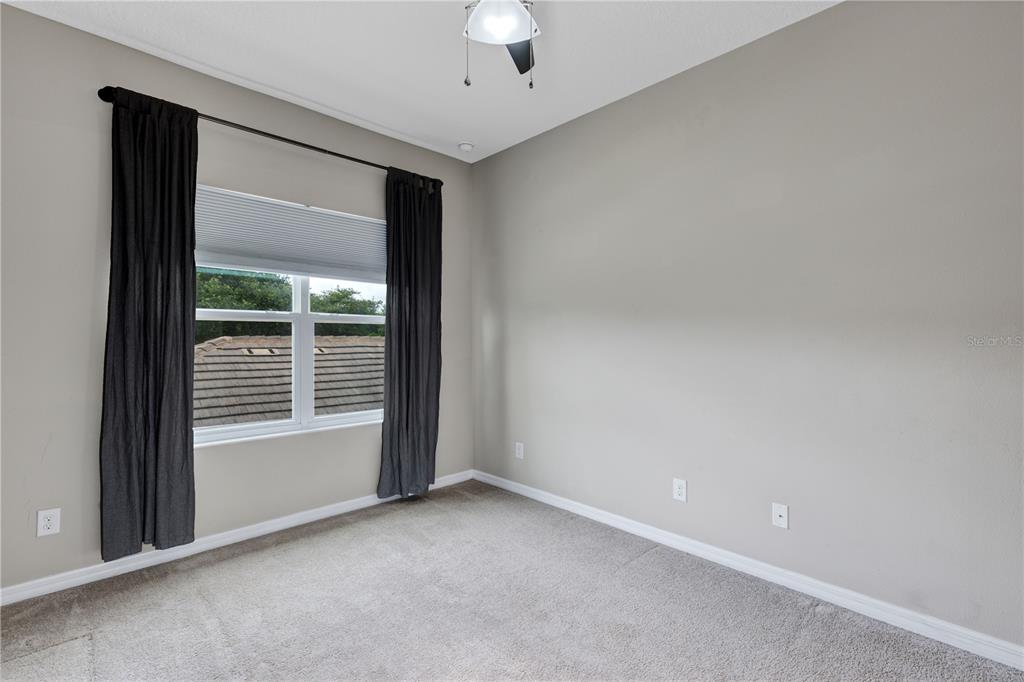 7644 Ripplepointe Way Windermere, FL 34786 - Photo 28 of 52 a view of an empty room with a window