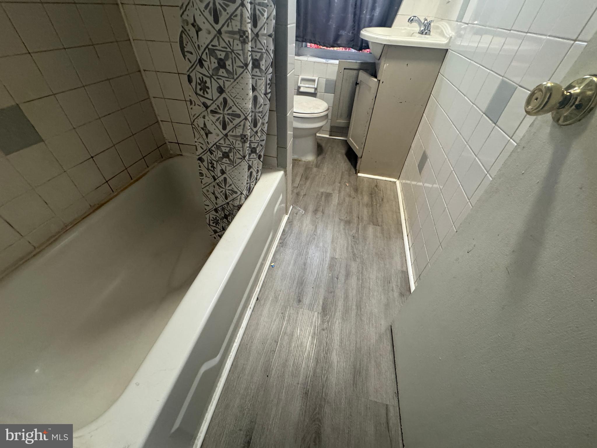 104 South 3rd Street Darby, PA 19023 - Photo 5 of 7 a bathroom with a toilet and a shower