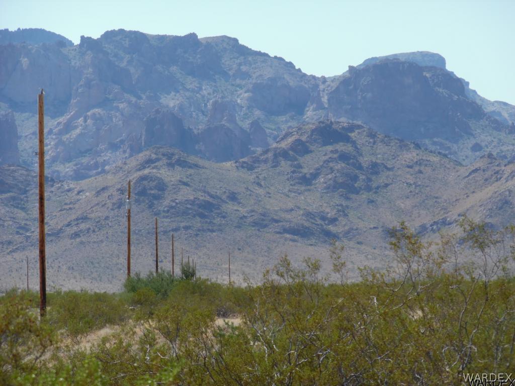 Tbd South Zircon Road Golden Valley, AZ 86413 - Photo 1 of 12 a view of a large mountain with a tree in front of it