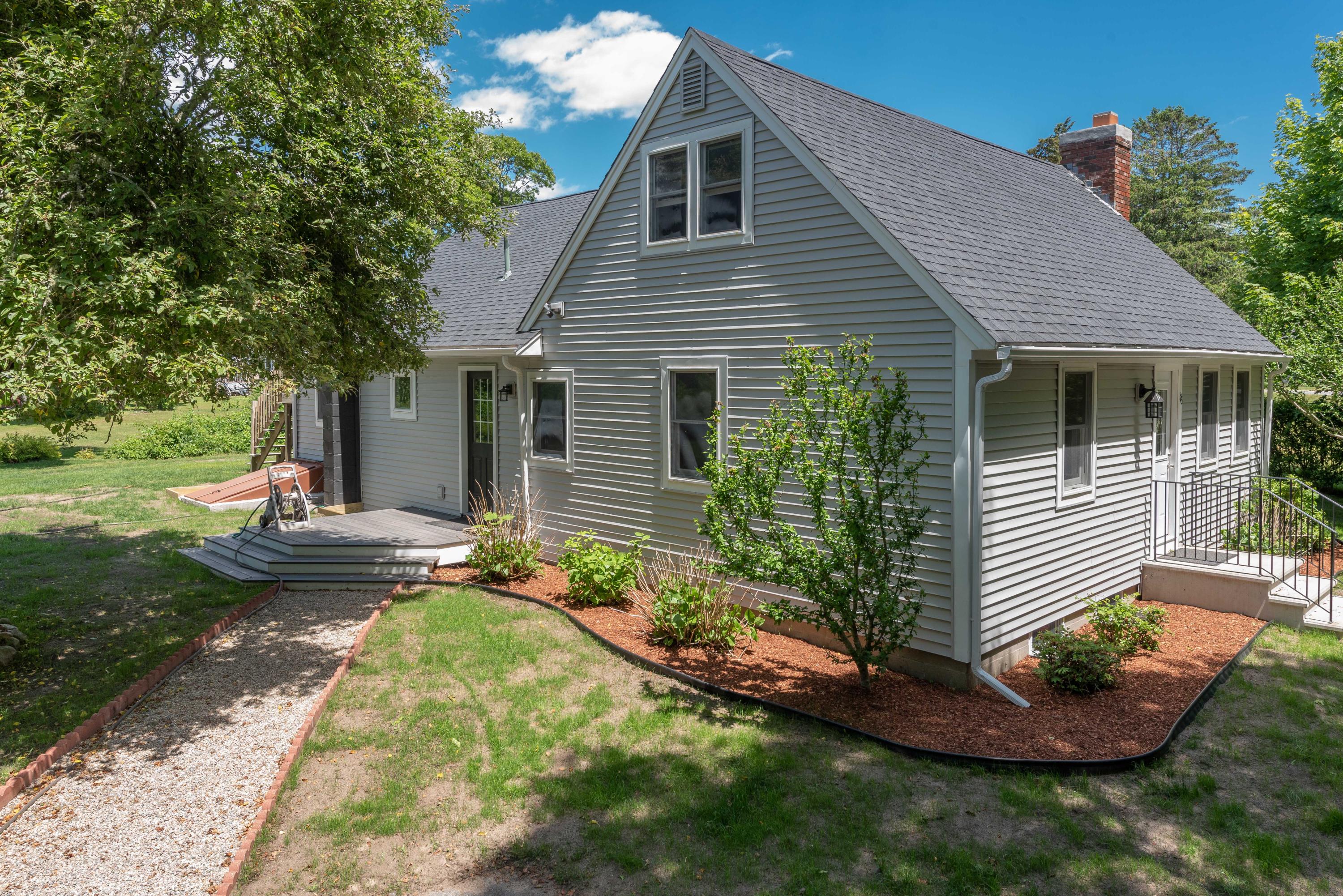 176 Shore Road Bourne, MA 02532 - Photo 2 of 25 a view of a house with backyard and garden
