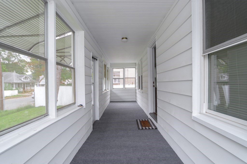 166 Laurelton Street Springfield, MA 01109 - Photo 28 of 34 a view of a hallway with a glass door and glass door