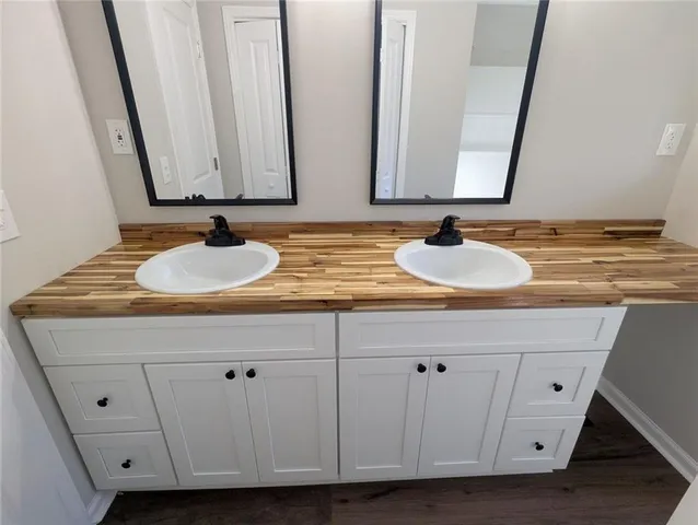 a bathroom with a sink and a mirror
