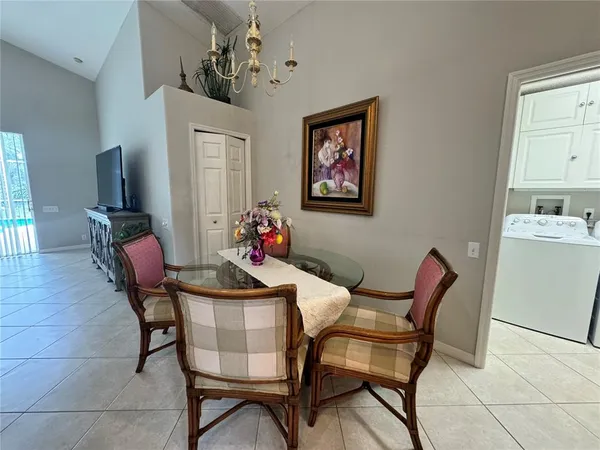 a dining room with furniture and window