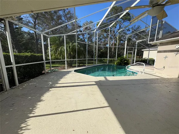 a view of a patio with a table and chairs