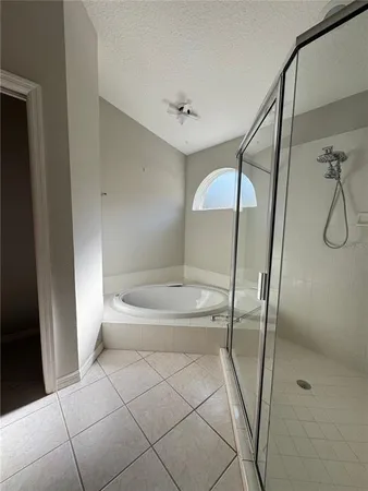 a bathroom that has a glass shower door