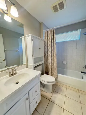 a bathroom with a sink toilet a shower and bathtub