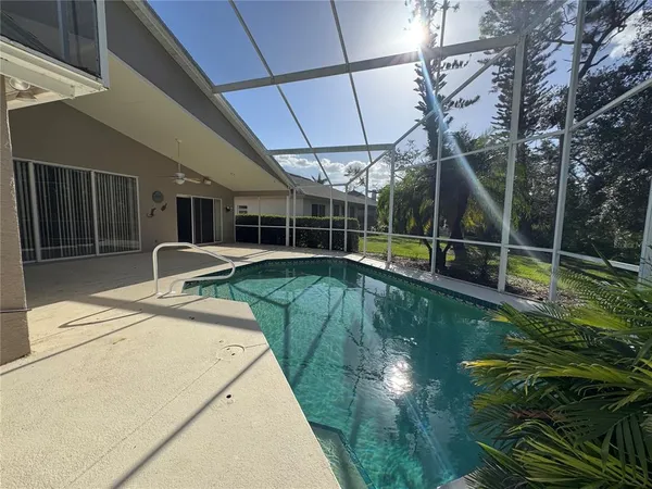 a view of a backyard with a small pool