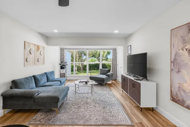 a large kitchen with a table and chairs