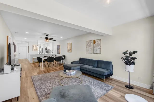 a kitchen with stainless steel appliances white cabinets and a sink
