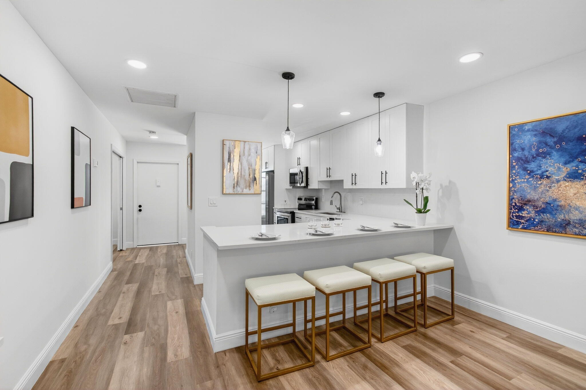 2825 Southwest 13th Street, Unit 204 Delray Beach, FL 33445 - Photo 17 of 62 a large kitchen with a table and chairs