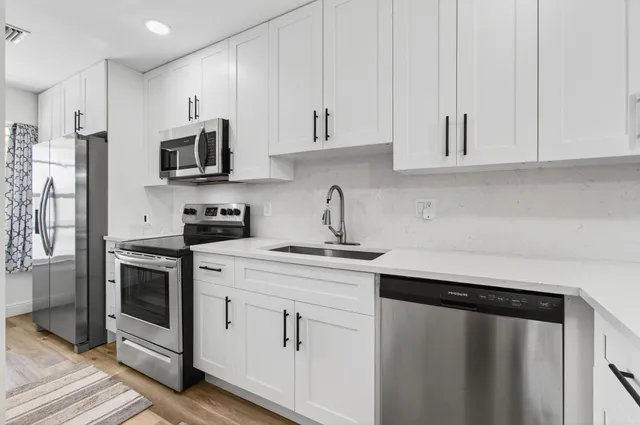 a view of a livingroom with furniture and wooden floor