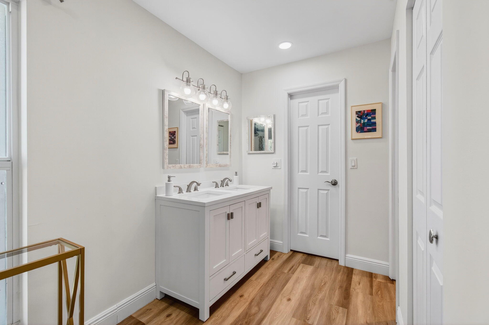 2825 Southwest 13th Street, Unit 204 Delray Beach, FL 33445 - Photo 31 of 62 a view of hallway with sink and wooden floor