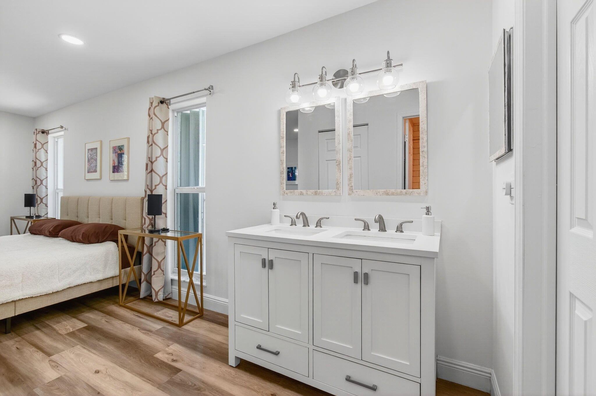 2825 Southwest 13th Street, Unit 204 Delray Beach, FL 33445 - Photo 32 of 62 a en suite bathroom with a double vanity sink and a mirror