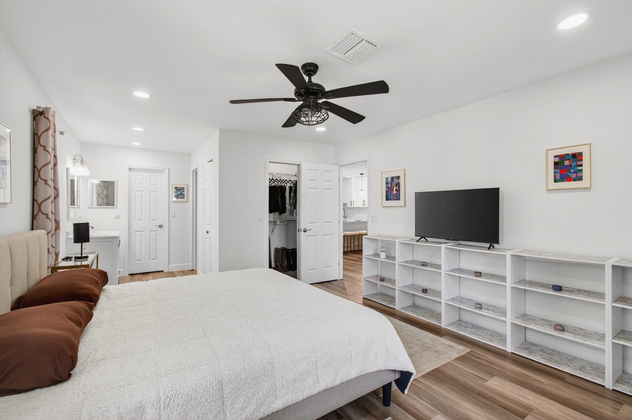 2825 Southwest 13th Street, Unit 204 Delray Beach, FL 33445 - Photo 35 of 62 a bedroom with a bed and a flat screen tv