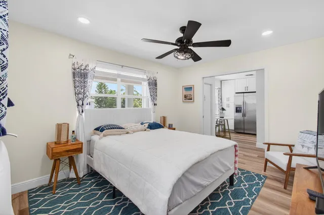 a view of a house with garden and sitting area