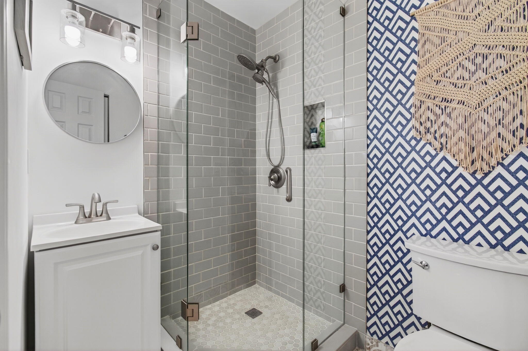 2825 Southwest 13th Street, Unit 204 Delray Beach, FL 33445 - Photo 39 of 62 a bathroom with a sink a toilet and shower